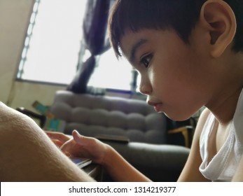 Malaysia - Circa January 2019 : Kid Playing And Watching Youtube Using  Smart Phone Or Tablet.