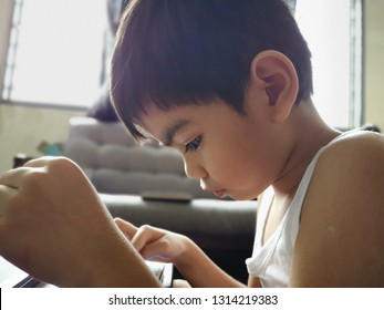 Malaysia - Circa January 2019 : Kid Playing And Watching Youtube Using  Smart Phone Or Tablet.