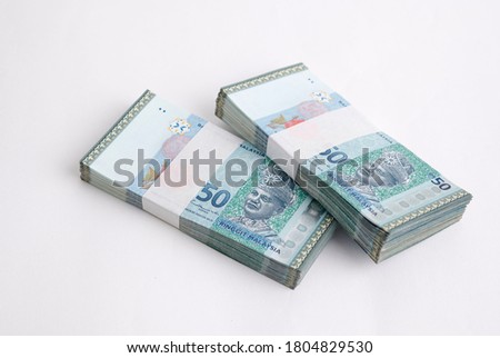 Malaysia Currency Ringgit 50: Stack of Ringgit Malaysia bank note on white background