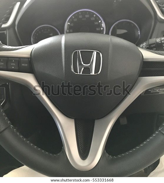 MALAYSIA - DECEMBER 22, 2016 : View\
of HONDA BR-V steering and speedometer. Focus on HONDA\
logo\
