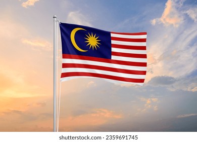 Malaysia flag waving on sundown sky