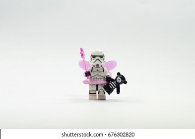 Malaysia, july 11, 2017. lego storm trooper wearing fairy costume holding teddy bear. Lego minifigures are manufactured by The Lego Group.