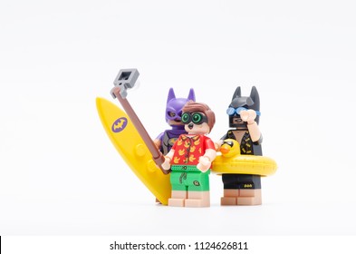 Batman Batgirl And Robin Taking Picture Together