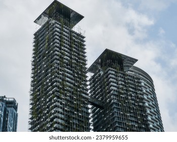 Malaysia, Kuala Lumpur, city center. Skyscrapers are braided by green plants. - Powered by Shutterstock