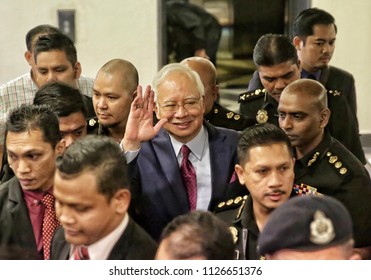 Malaysia, Kuala Lumpur - July 04, 2018 : Former Malaysian Prime Minister Najib Razak (c-red Tie) Is Surrounded As He Leaves The Duta Court Complex After Posting Bail In.