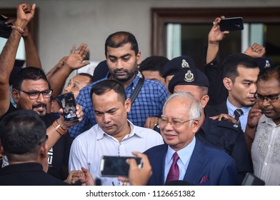 Malaysia, Kuala Lumpur - July 04, 2018 : Former Malaysian Prime Minister Najib Razak (c-red Tie) Is Surrounded As He Leaves The Duta Court Complex After Posting Bail In.