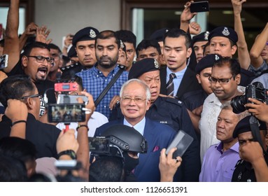 Malaysia, Kuala Lumpur - July 04, 2018 : Former Malaysian Prime Minister Najib Razak (c-red Tie) Is Surrounded As He Leaves The Duta Court Complex After Posting Bail In.