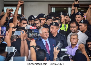 Malaysia, Kuala Lumpur - July 04, 2018 : Former Malaysian Prime Minister Najib Razak (c-red Tie) Is Surrounded As He Leaves The Duta Court Complex After Posting Bail In.