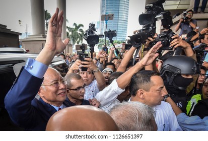 Malaysia, Kuala Lumpur - July 04, 2018 : Former Malaysian Prime Minister Najib Razak (c-red Tie) Is Surrounded As He Leaves The Duta Court Complex After Posting Bail In.