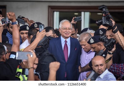 Malaysia, Kuala Lumpur - July 04, 2018 : Former Malaysian Prime Minister Najib Razak (c-red Tie) Is Surrounded As He Leaves The Duta Court Complex After Posting Bail In.