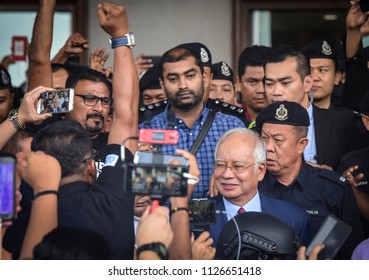 Malaysia, Kuala Lumpur - July 04, 2018 : Former Malaysian Prime Minister Najib Razak (c-red Tie) Is Surrounded As He Leaves The Duta Court Complex After Posting Bail In.