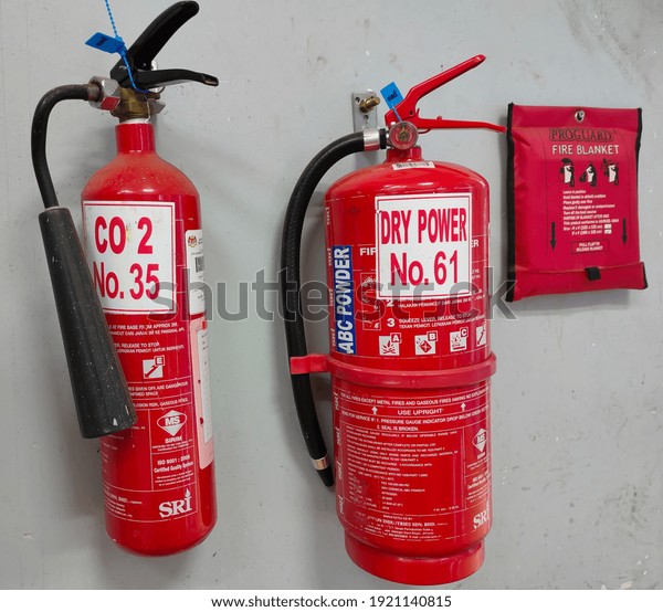 Malaysia, Perak, 18 February 2021: Selective\
focus.Two types of fire extinguishers with fire blanket in a\
laboratory.Shot were noise and\
artifacts.