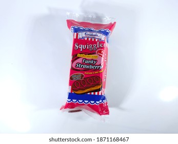 Malaysia, Perak, 9 December 2020: Selective Focus.Gardenia Squiggle Cream Core Bread Funky Strawberry Isolated On White Background.