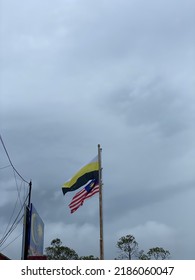 Malaysia And Perak Flag On Rainy Day