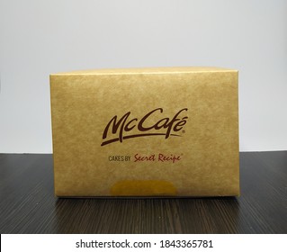 Malaysia, Sabah, 29.Oct.2020 : Box Cake By Secret Recipe Review Brand Of McCafe Mcdonald's Insolated On A White And Black Background.