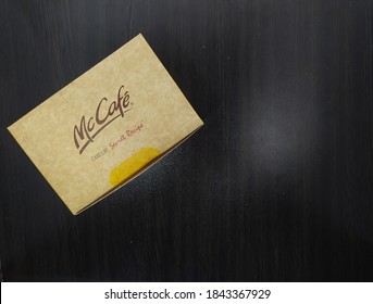 Malaysia, Sabah, 29.Oct.2020 : Box Cake By Secret Recipe Review Brand Of McCafe Mcdonald's Insolated On Black Background. Top Mockup.