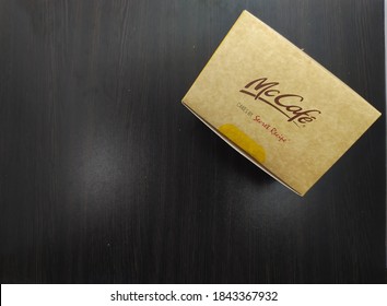 Malaysia, Sabah, 29.Oct.2020 : Box Cake By Secret Recipe Review Brand Of McCafe Mcdonald's Insolated On Black Background. Top Mockup.