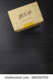 Malaysia, Sabah, 29.Oct.2020 : Box Cake By Secret Recipe Review Brand Of McCafe Mcdonald's Insolated On Black Background. Top Mockup.