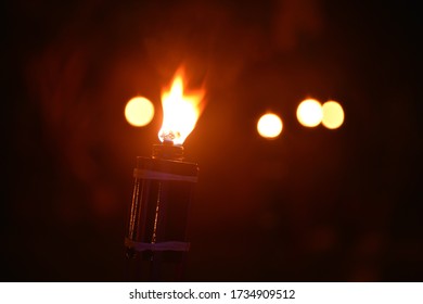 Malaysia Traditional Celebratory Oil Lamps Burning In Low Lighting (Lampu Pelita)