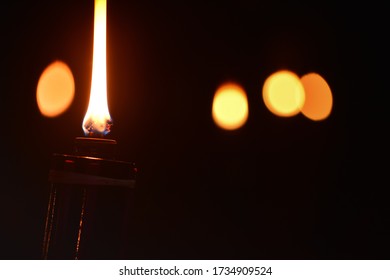 Malaysia Traditional Celebratory Oil Lamps Burning In Low Lighting (Lampu Pelita)