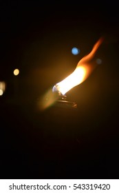 Malaysia Traditional Celebratory Oil Lamps Burning In Low Lighting (Lampu Pelita)