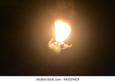 Malaysia Traditional Celebratory Oil Lamps Burning In Low Lighting (Lampu Pelita)