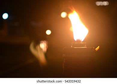 Malaysia Traditional Celebratory Oil Lamps Burning In Low Lighting (Lampu Pelita)