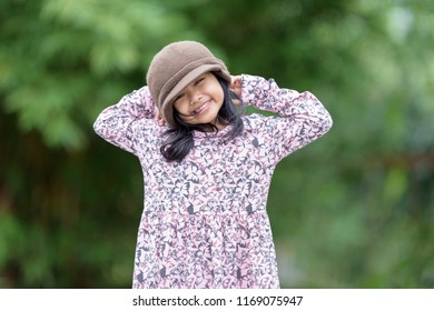 Malaysia-Kuala Lumpur-June-24-2018:The Unidentified Little Girl Smiling In Her Home At Fisherman Village,Malay Young Malaysian Kids Greeting To Tourists With Smiling Faces