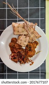 Malaysian Authentic Festive Season Food, During Eidul Fitr Or Eidul Adha, Ketupat, Spicy Fried Sambal, Beef Rendang, Chicken Rendang, Top View Meal