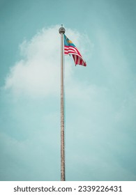 Malaysian Flag Flying with sky as background at Medaka square in Kuala Lumpur Malaysia