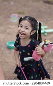 Malaysian Girl Children With Excited Facial Expression