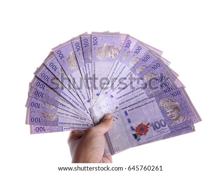 Malaysian Ringgit money in 100 nominal spreaded hand held, isolated over white background