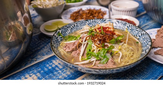 Malaysian soup noodles or locally know as Bihun Sup Utara with ingredients. Selective focus. - Shutterstock ID 1932719024