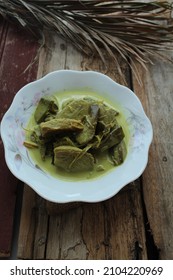 Malaysian Village Recipe Gulai Pisang Lemak Cili Api On Wooden Background 