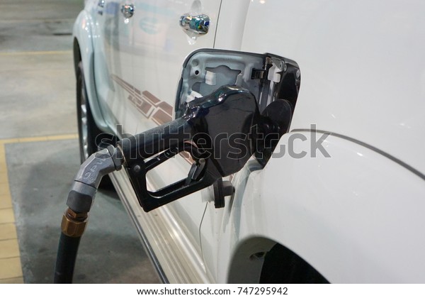 Malaysia-Nov\
2, 2017; A car fueling at Petronas petrol pump. From 2014, Malaysia\
fuel prices will be floated to International price. Fuel price will\
be revealed at every wednesday of the\
week.