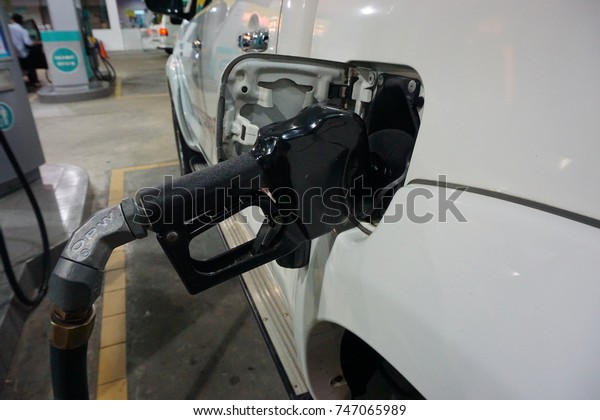 Malaysia-Oct\
29,2017:A car fueling at Petronas petrol pump. From 2014, Malaysia\
fuel prices will be floated to International price. Fuel price will\
be revealed at every Wednesday of the\
week.