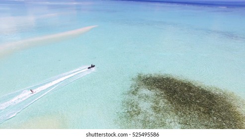 Maldives Island Indian Ocean Jet Ski Wakeboarding Aerial Top View. 