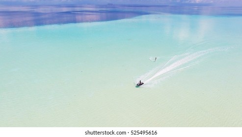 Maldives Island Indian Ocean Jet Ski Wakeboarding Aerial Top View. 