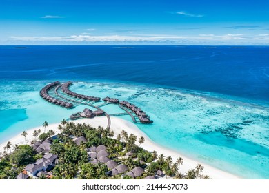 Maldives paradise island. Tropical aerial landscape, seascape with jetty, water bungalows villas with amazing sea lagoon beach. Exotic tourism destination, summer vacation background. Aerial travel - Shutterstock ID 2144467073
