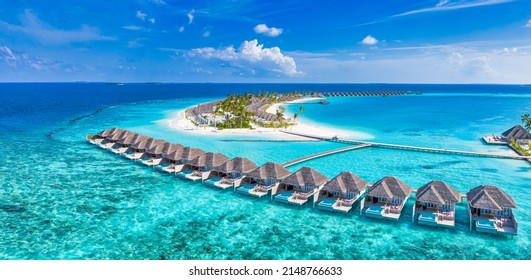 Maldives paradise island. Tropical aerial landscape, seascape with jetty, water bungalows villas with amazing sea lagoon beach. Exotic tourism destination, summer vacation background. Aerial travel