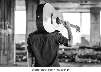 Male With Acoustic Guitar Outdoor, Black And White Photo