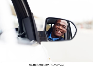 Male African American Driver Looking At Rear Mirror