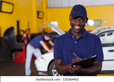 Male African American Vehicle Mechanic Writing Report