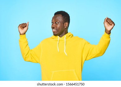 male African appearance Studio model blue background