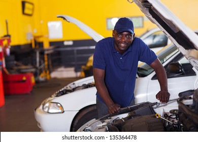 male african car mechanic inside workshop