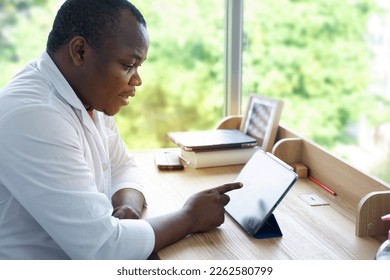 Male African doctor talking on conference video call to patient . virtual therapist consulting  patients online on tablet, Tele medicine chat