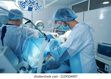 Male Anesthesiologist Providing Anaesthetic Gas Supply Through Mask