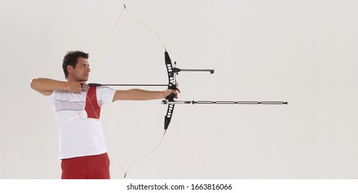Male archer aiming, side view