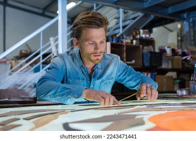 a male architect working late - Powered by Shutterstock