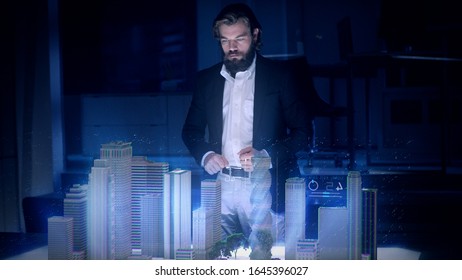 Male Architect works with Holographic Augmented Reality 3D City Model using gestures showing graphs. Technologically Advanced Office with Augmented Virtual Modeling Software on Futuristic Display. - Powered by Shutterstock - Get 15% off with code: PIKWIZARD15